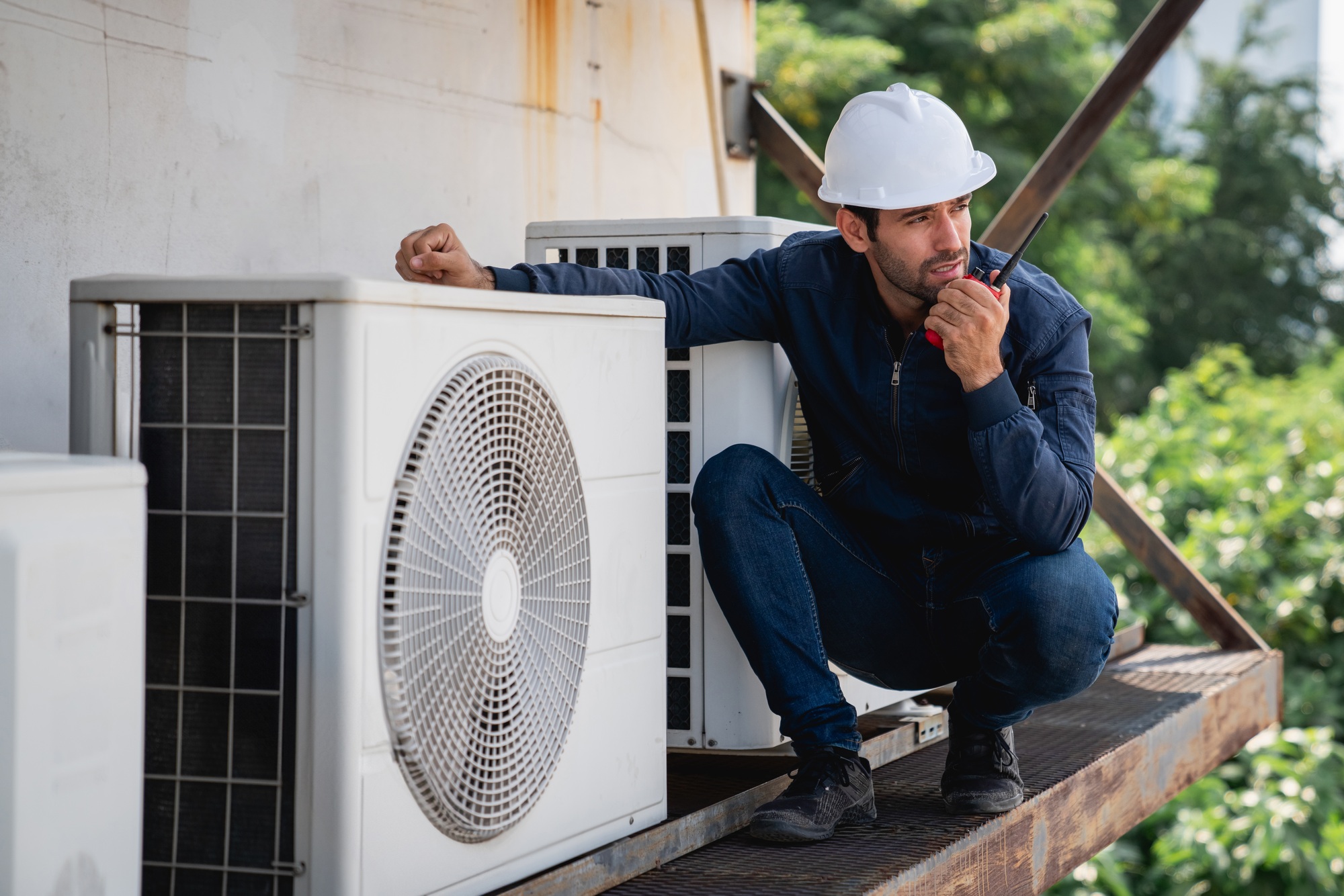Engineers checking air conditioning cooling system of a major building or industrial facility.